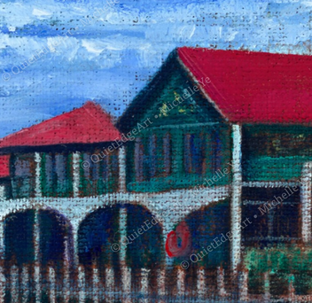 Artistic depiction of houses with red roofs on a blue sky background