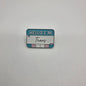 A colorful LGBT-themed enamel lapel pin showing 'Hello I'm Trans'.
