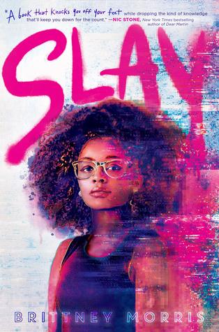 The cover image features a young woman with vibrant, curly hair, wearing glasses and a sleeveless top, against a dynamic, colorful background with the title 'SLAY' prominently displayed.
